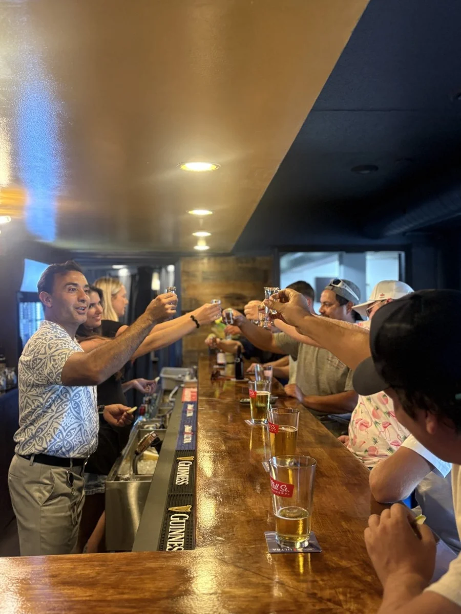 Friends raising a toast at the Friendly Fork bar