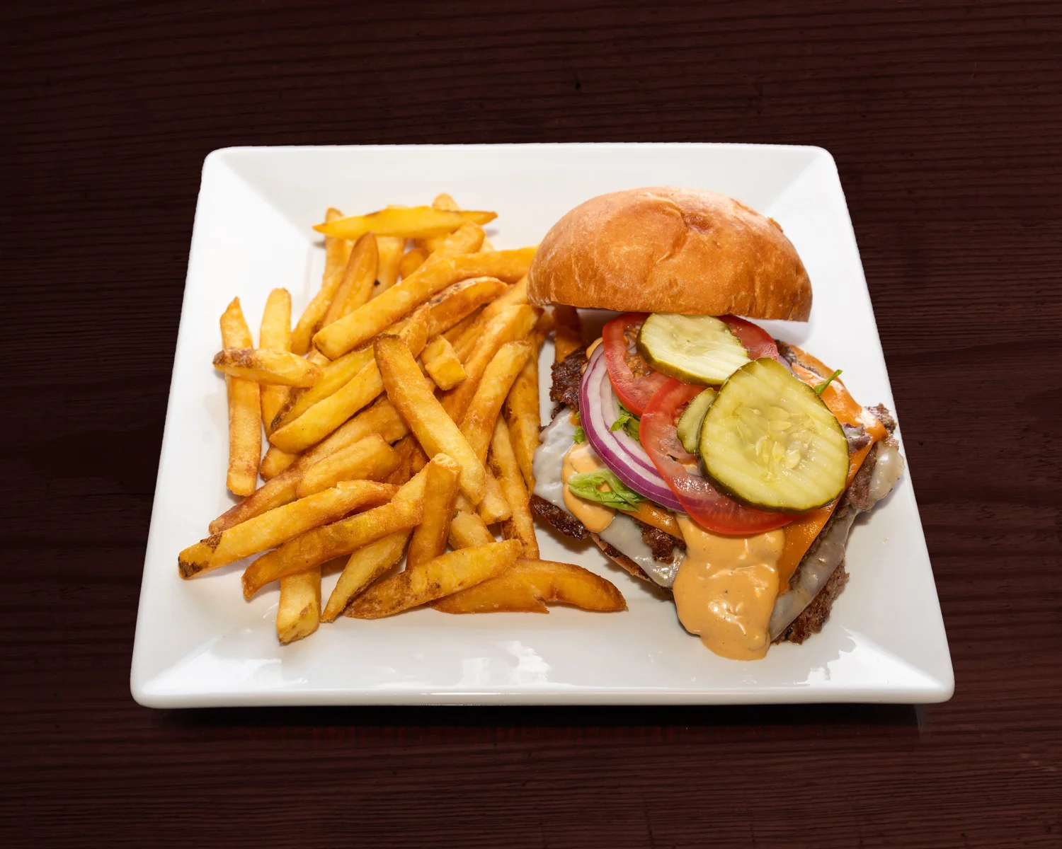 Friendly Fork smash burger with golden fries and pickles